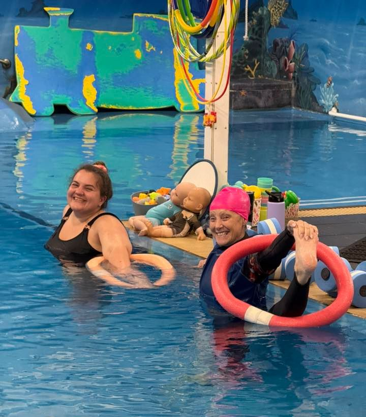 Two women in a pool exercising with flotation devices โ Swim Care Boambee in Coffs Harbour, NSW
