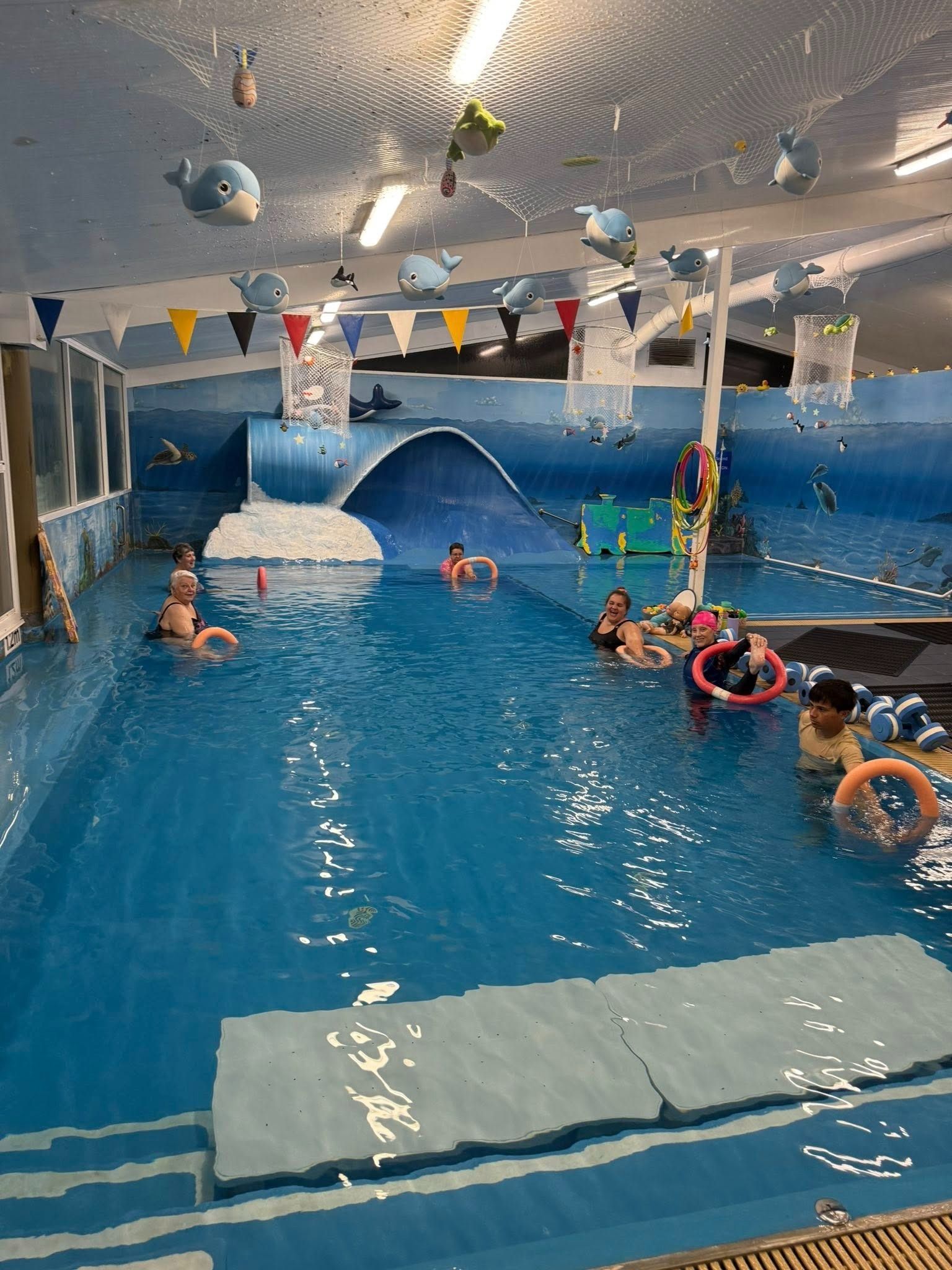Indoor Pool With Children and Adults Swimming