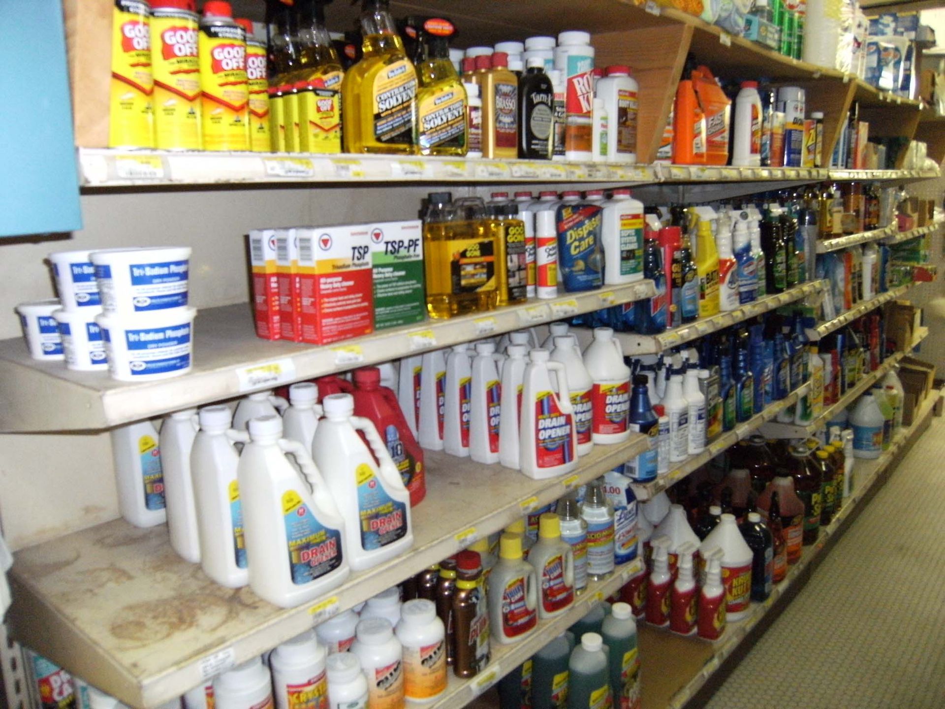 A store aisle filled with lots of cleaning supplies including clorox