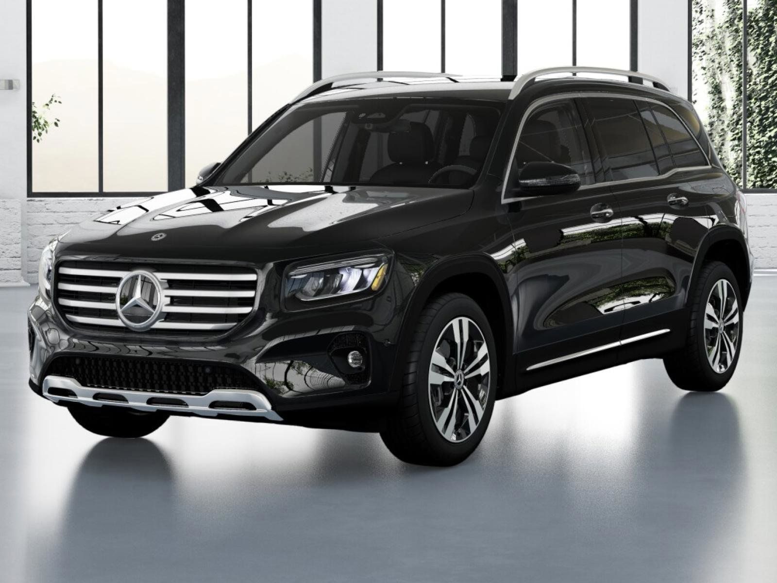 Black Mercedes-Benz GLB SUV parked inside a modern showroom, showcasing its design.