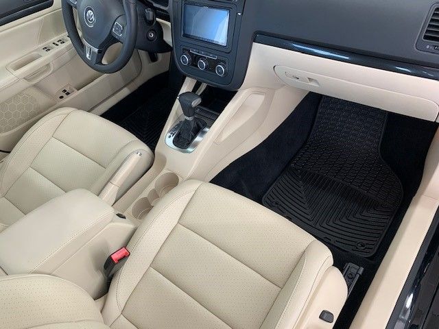The interior of a car with beige leather seats