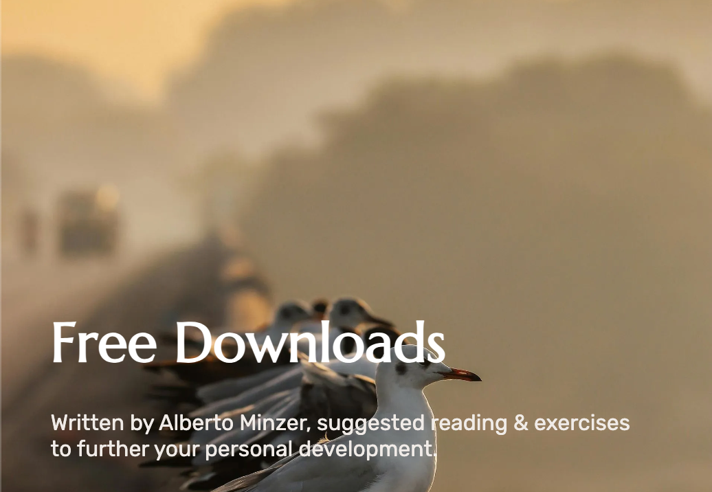 “Free Downloads” text over a hazy outdoor landscape with a small signpost on the left