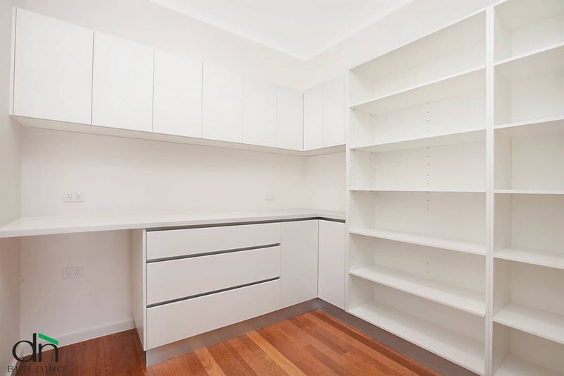 An Empty Office with Shelves — Custom Cabinets Design in Berrimah, NT