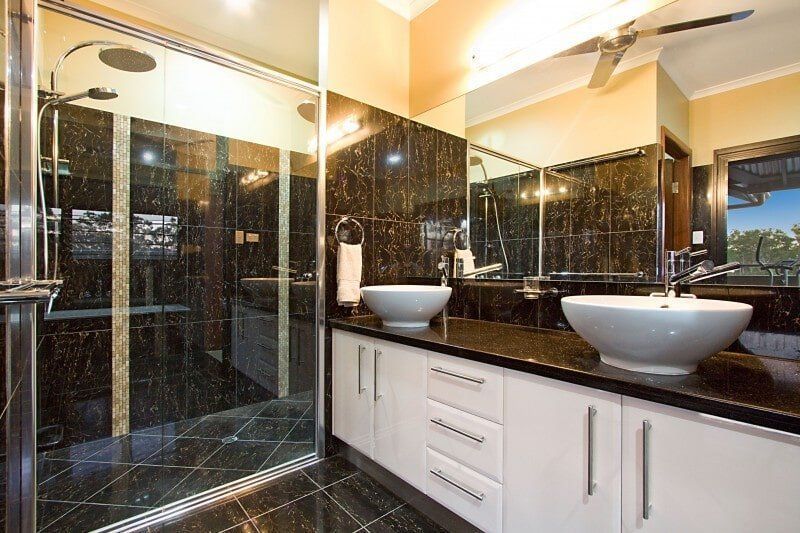 A Bathroom with Two Sinks and A Walk in Shower — Custom Cabinets Design in Berrimah, NT