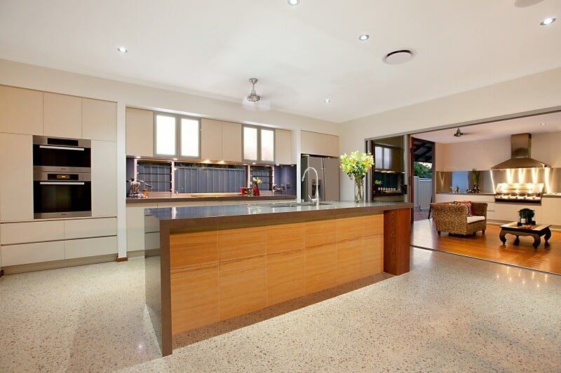 A Large Kitchen with A Large Island in The Middle — Custom Cabinets Design in Berrimah, NT