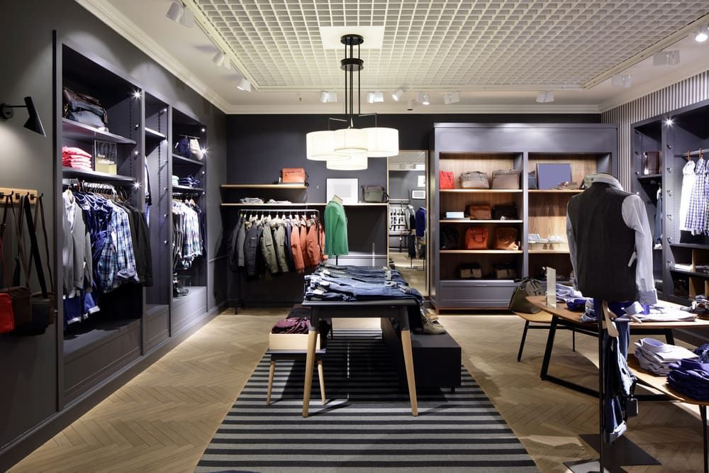 A Clothing Store With a Table in the Middle of It — Custom Cabinets Design in Berrimah, NT