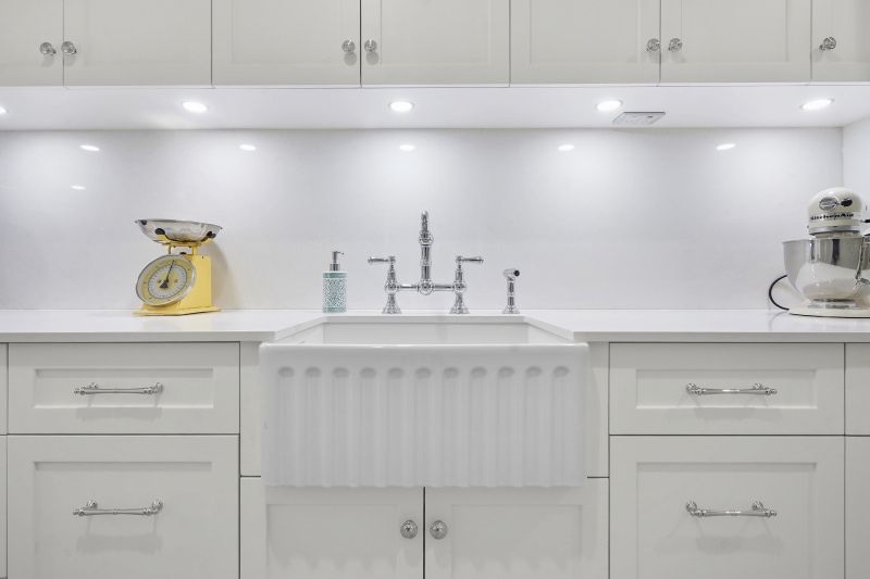 A Kitchen With White Cabinets and a White Sink — Custom Cabinets Design in Berrimah, NT