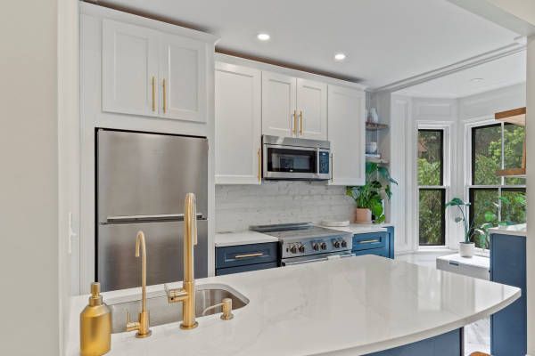 Kitchen with White Cabinets, and Appliances Kitchen with White Cabinets, and Appliances