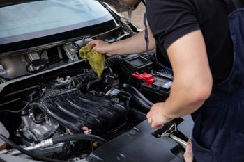 Mechanic Performing Engine Bay Maintenance | Nagel's Auto Service