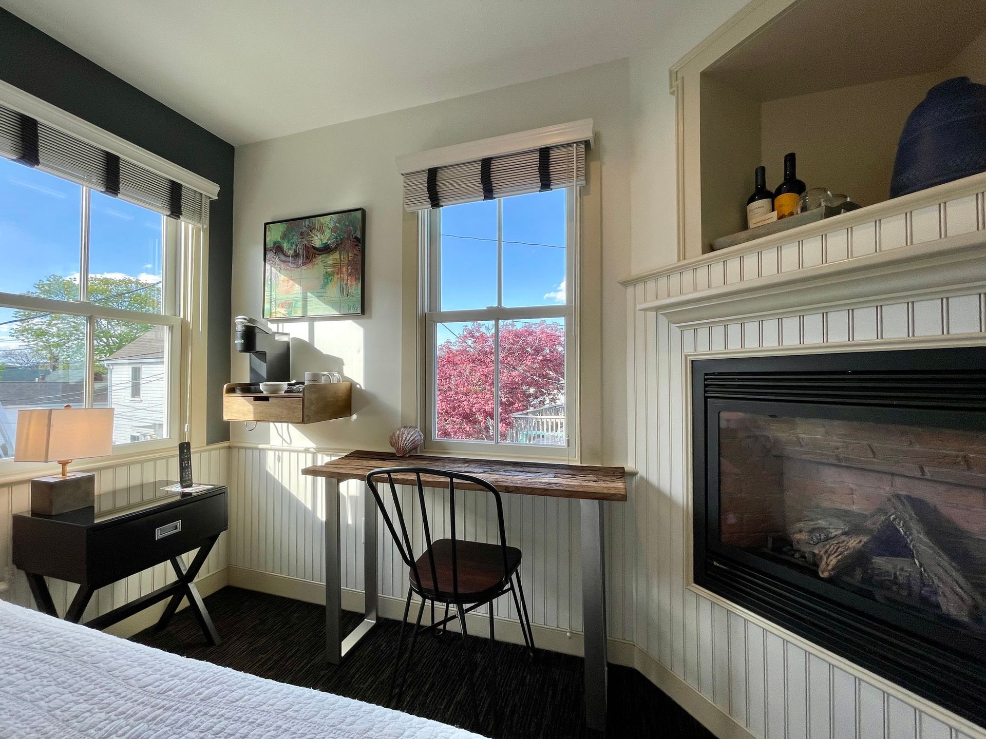 Interior picture: Nauset Light King guest room with bed, writing desk, fireplace, and great lighting.