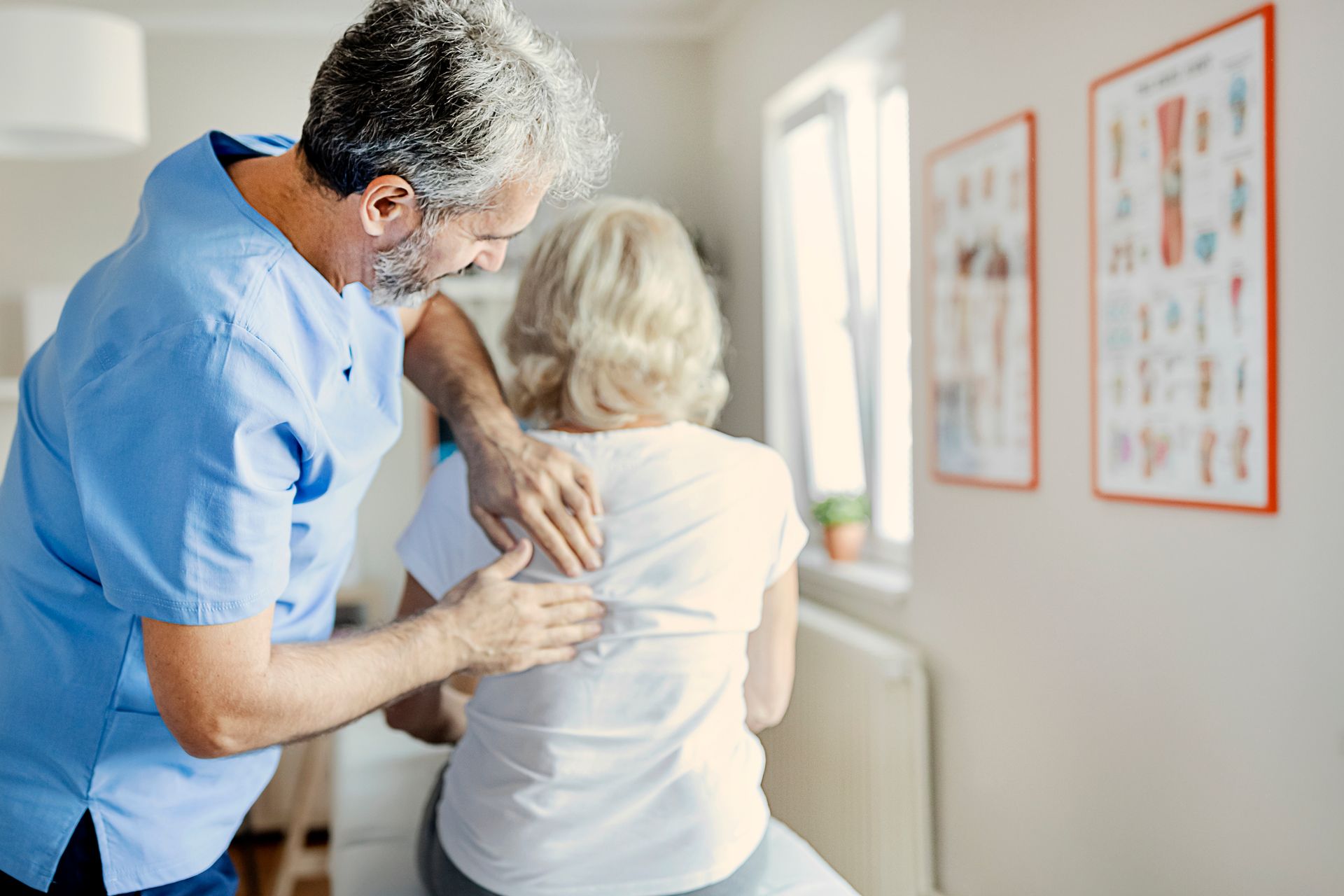 Massaging Elderly Patient's Back — Little Falls, NJ — Health on Main