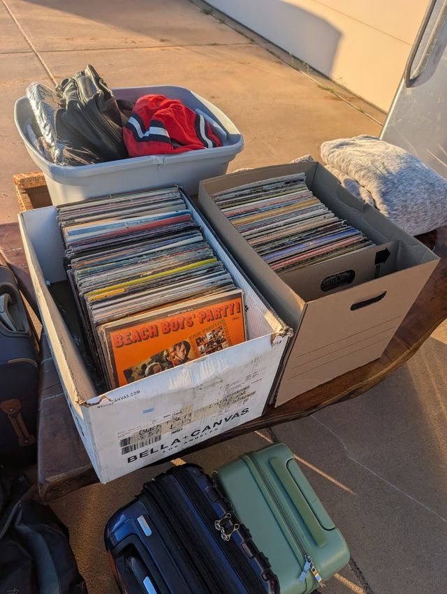 Two boxes of LPs, with The Beach Boys' Party! in front, on a tailgate at an Arizona pickup