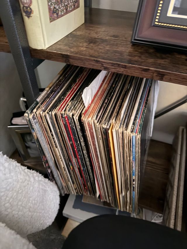 A shelf of well-played vintage LPs in a home collection
