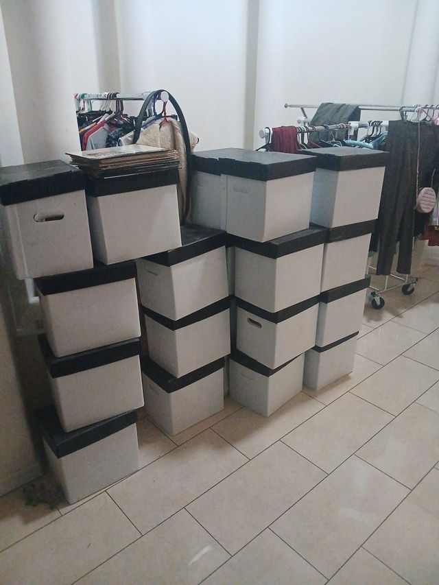 About 16 record boxes stacked and ready for pickup