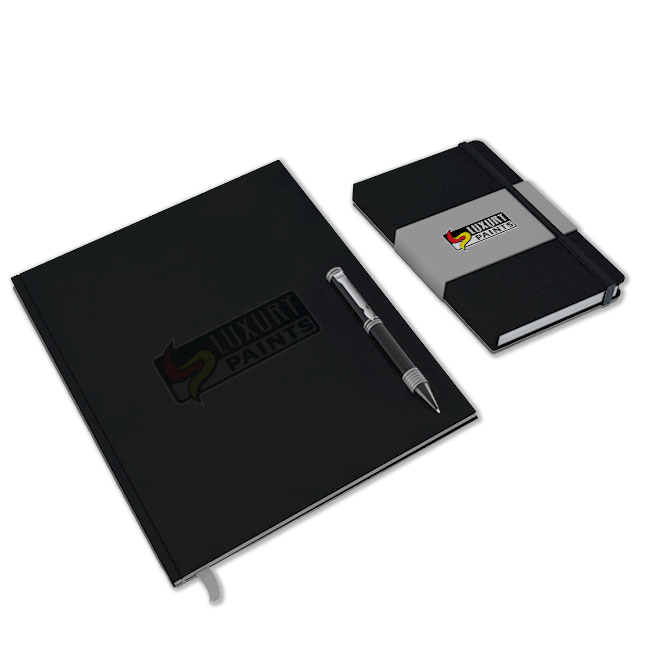 Black notebook and smaller black notepad with pen on a white background