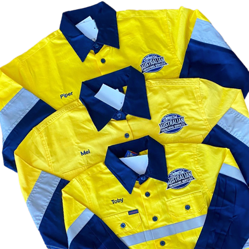 Three yellow and blue collared shirts stacked together with reflective stripes and embroidered logos