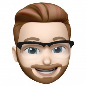 Smiling cartoon face with brown hair, beard, and black glasses