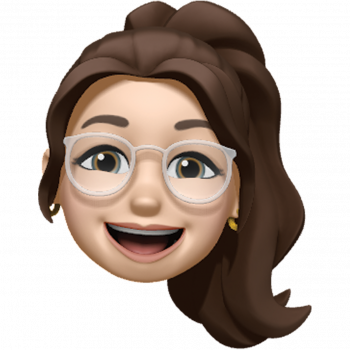 Smiling cartoon face with glasses and brown hair in a ponytail
