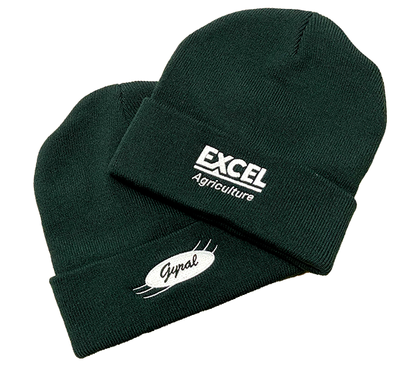 Two dark green knit beanies with white embroidered logos, stacked on a white background