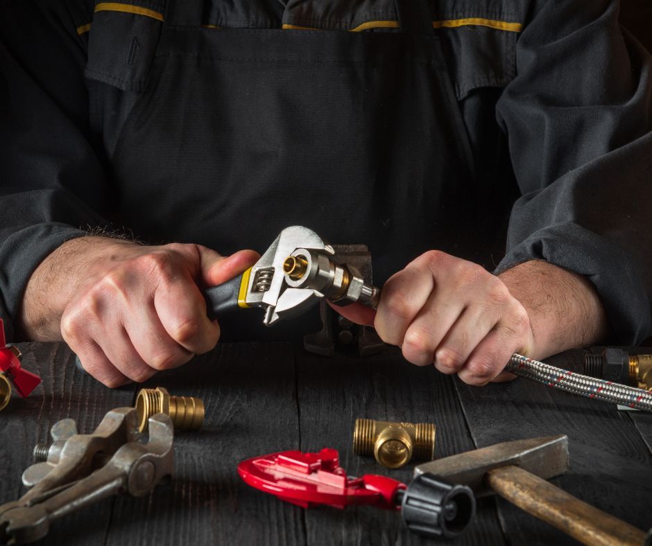 A plumber fixing a