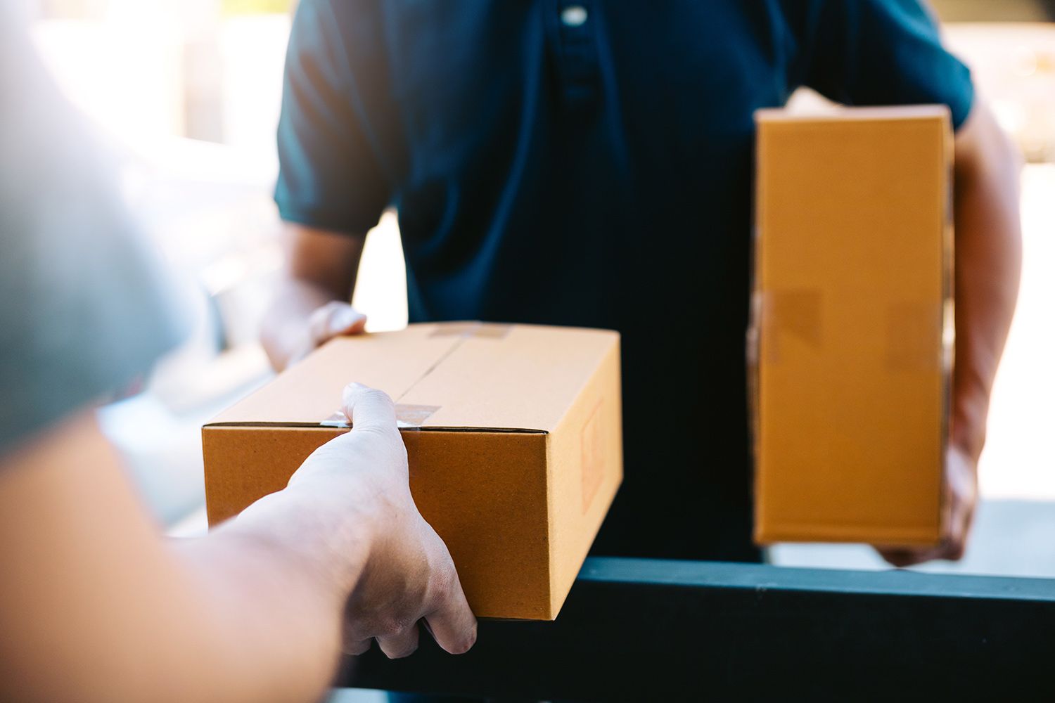 A person handling a delivery package