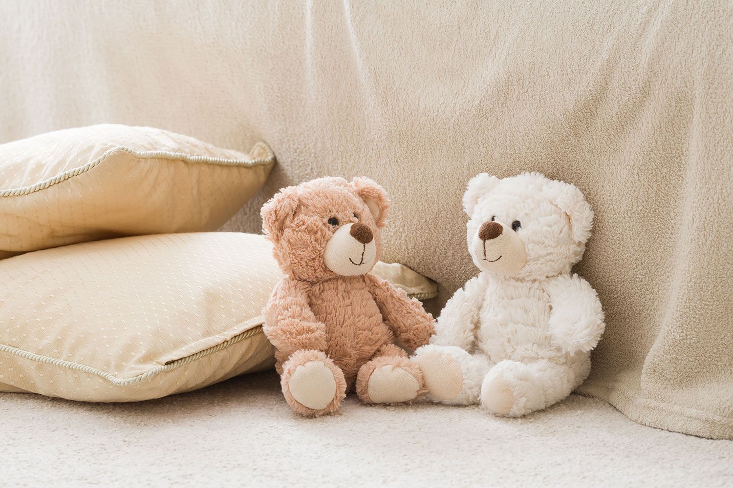 Stuffed toys on bed
