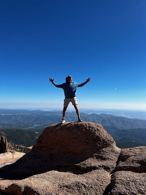 Coach David Berger on top of a mountain in Colorado