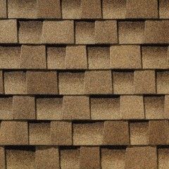 A close up of a roof made of shakewood shingles.
