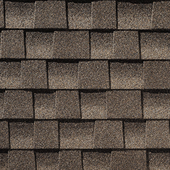 A close up of a roof with missionwood shingles on it.