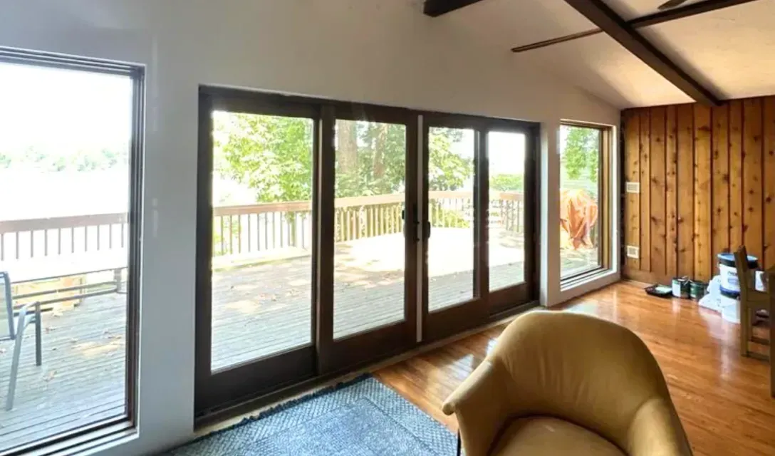 4 large windows, and a set of glass doors. 