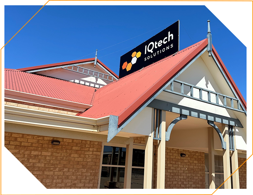A building with a sign that says iqtech solutions