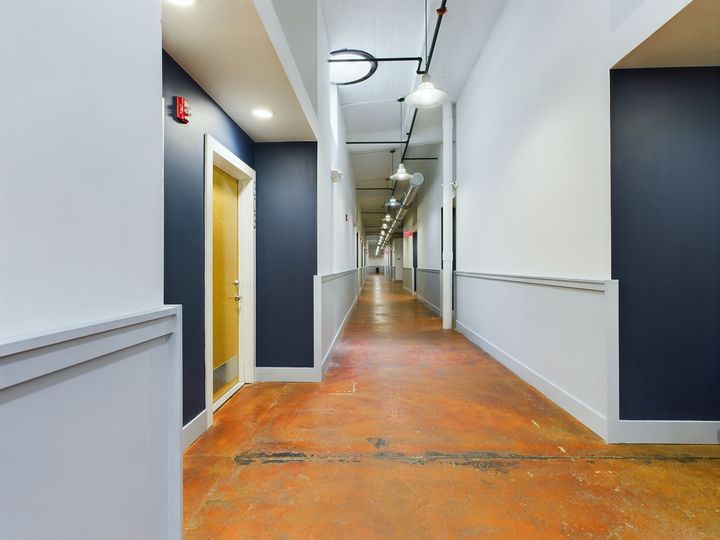 A long hallway with blue and white walls