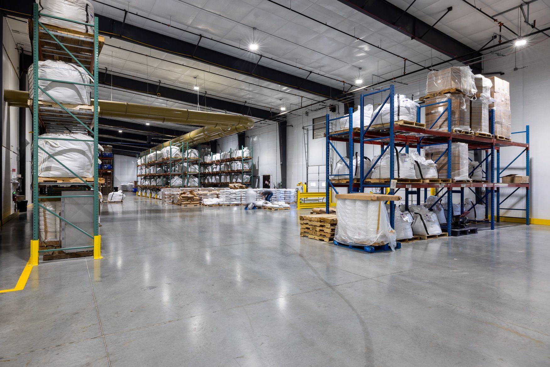 Xtra Factors East Earl, PA warehouse filled with lots of shelves and pallets.