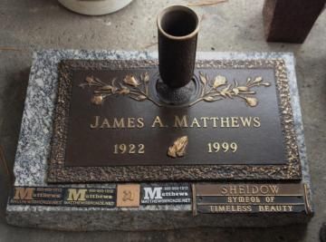Gravestone plaque for James A. Matthews, 1922–1999, with a bronze memorial and vase.