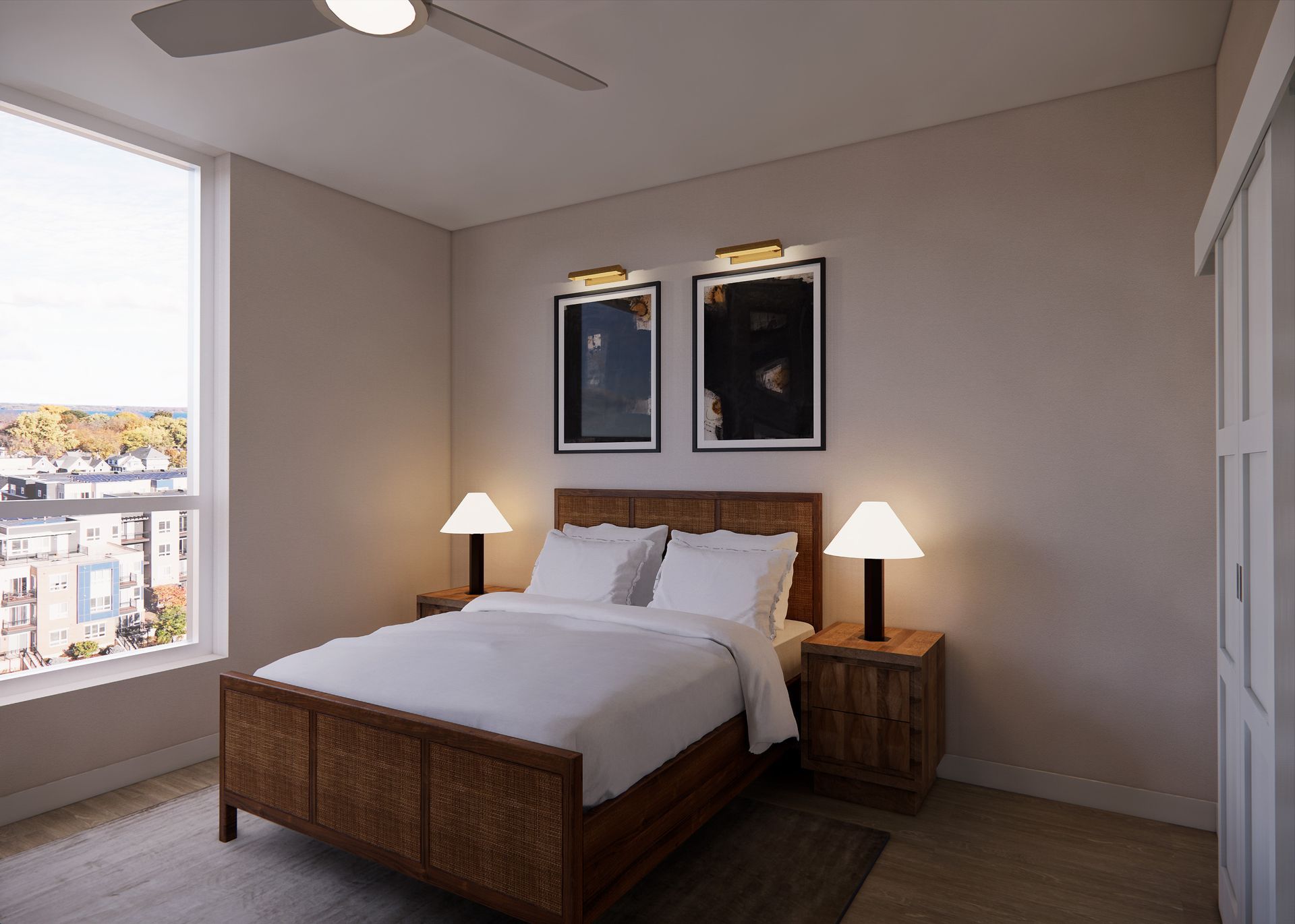 A modern bedroom with a wooden bed, white bedding, two bedside lamps, and framed art on a neutral wall near a window.