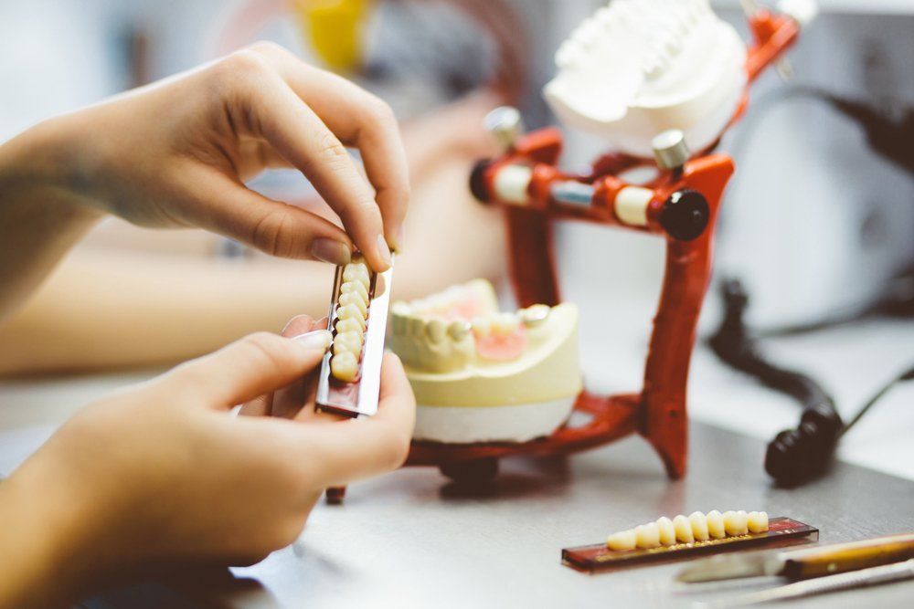 Female Dental Working on The Denture — Little Rock, AR — Heathman Family Dental