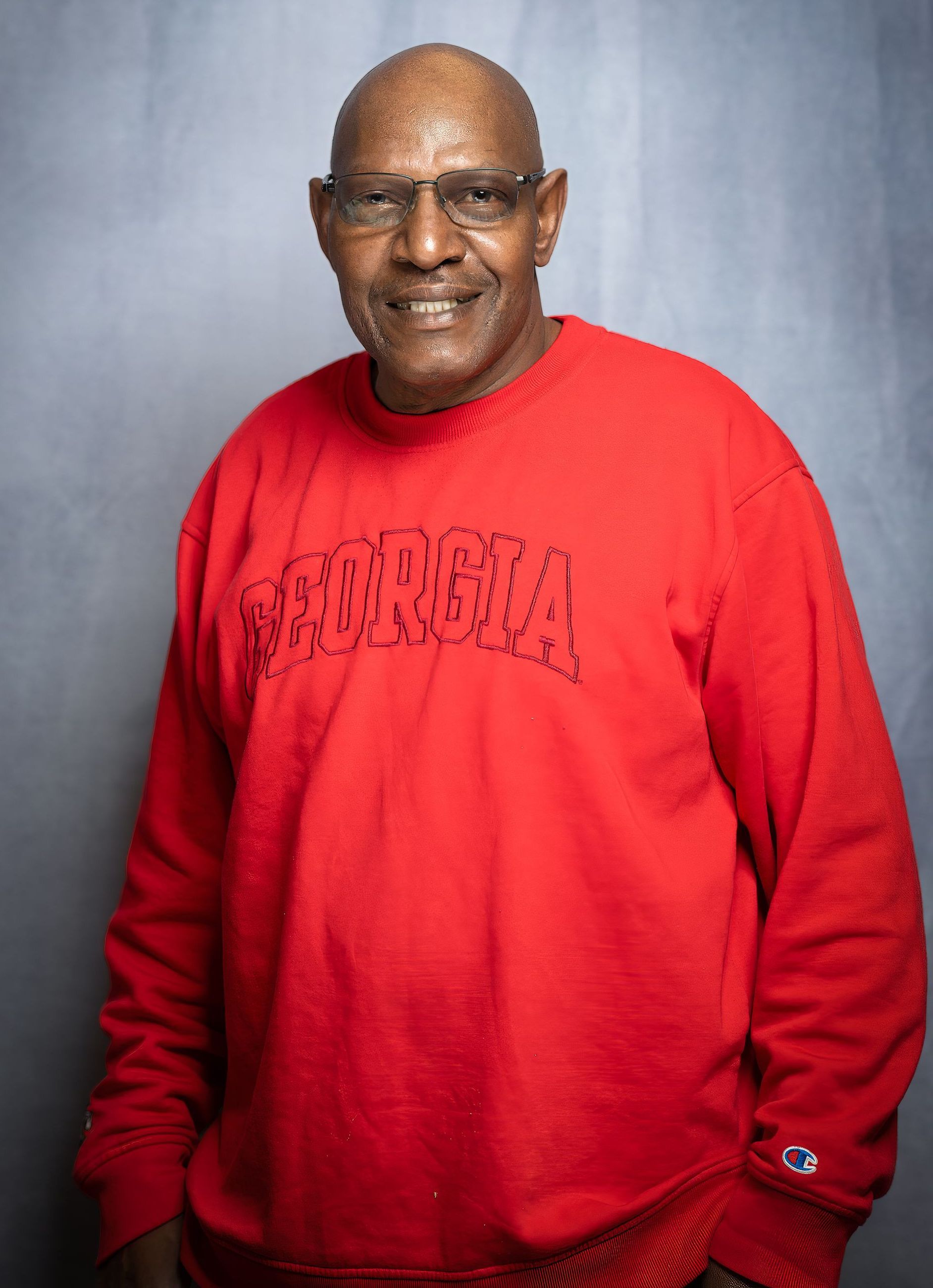 A person wearing a bright red sweatshirt with