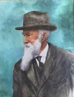 Portrait of an elderly bearded man in a dark suit and hat against a blue background