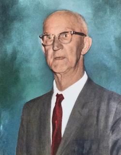 Portrait of an elderly man in glasses, wearing a gray suit and red tie against a blue background