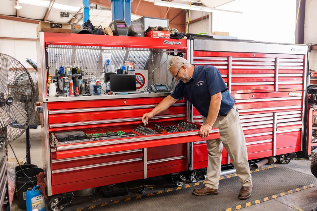 Owner electing tools from a red toolbox | Stephen's Automotive