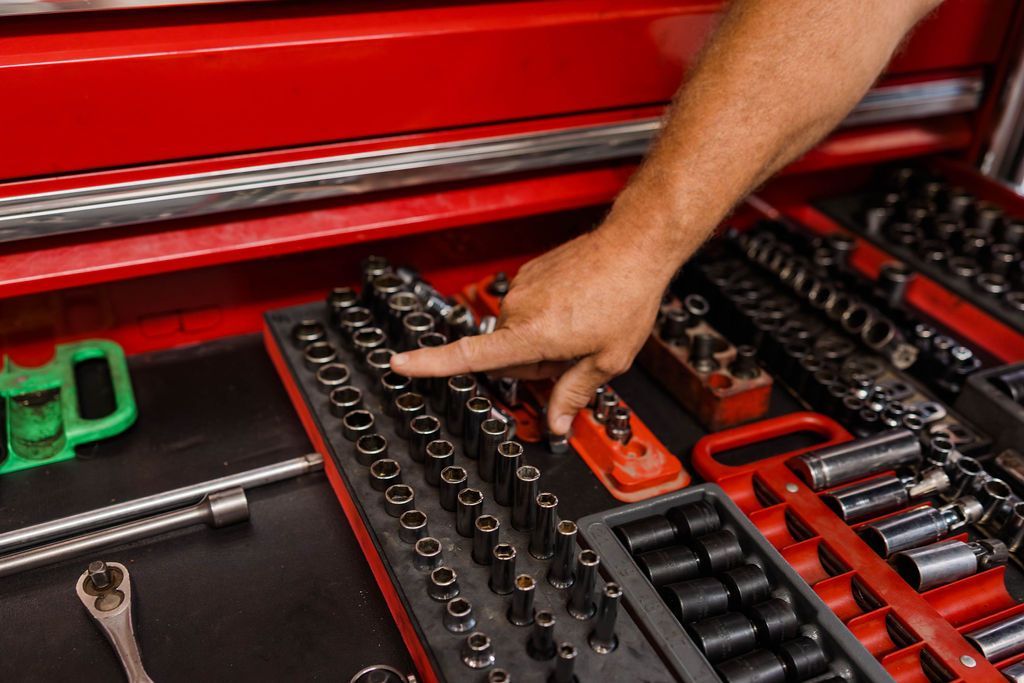 Person's hand pointing to a set of sockets | Stephen's Automotive