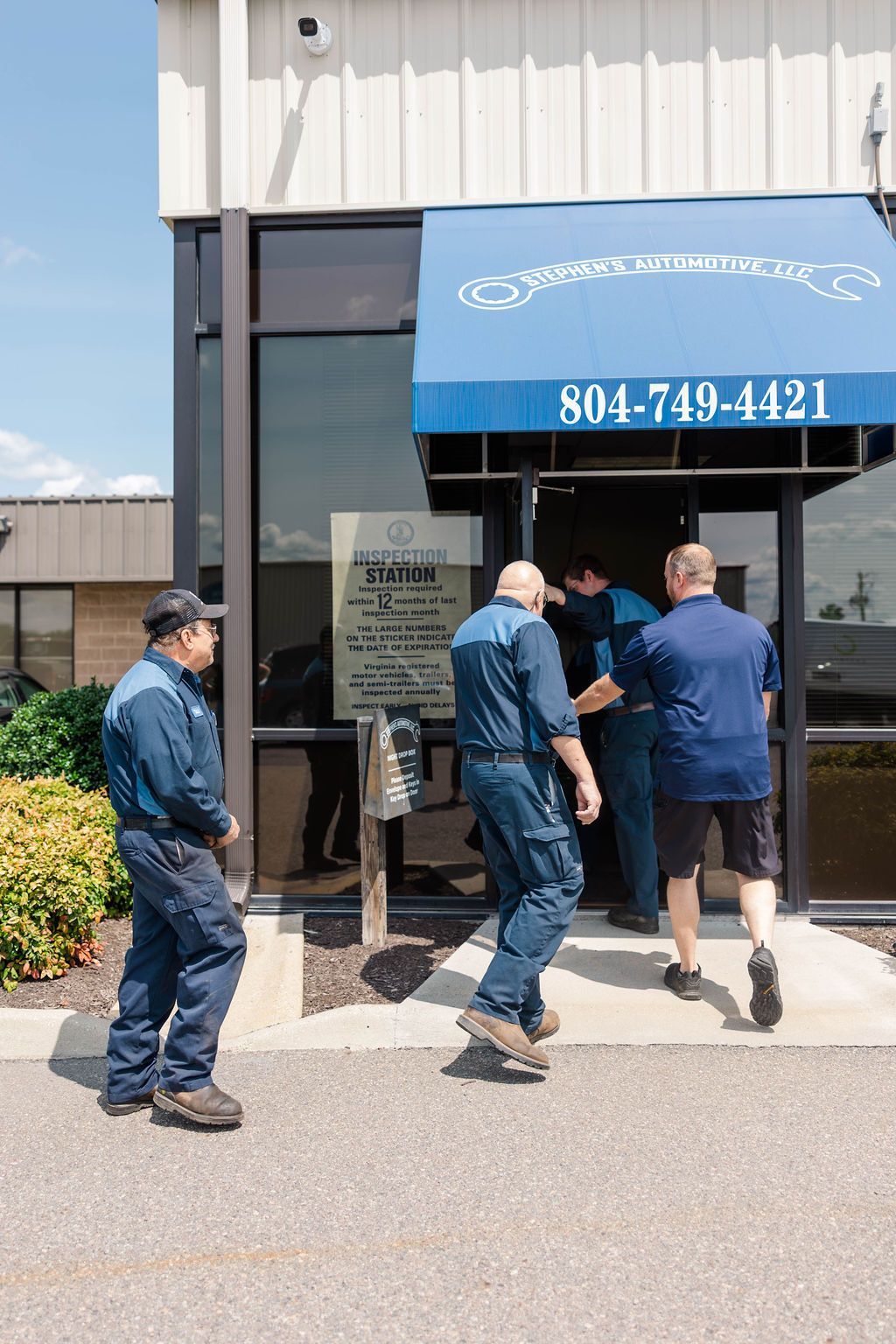 Stephen's Automotive team in front of their auto shop | Stephen's Automotive