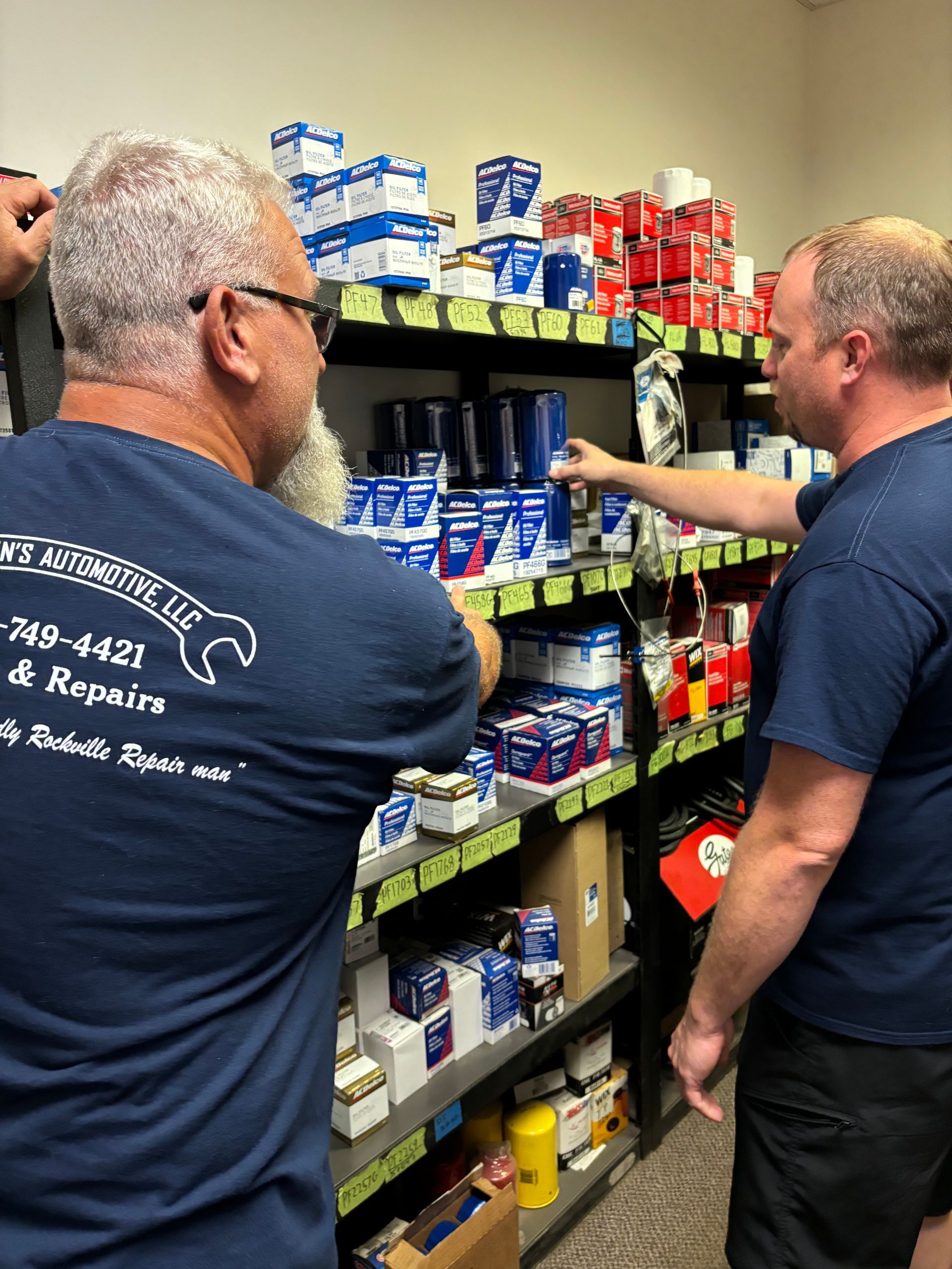 Mechanics browsing shelves of automotive supplies | Stephen's Automotive