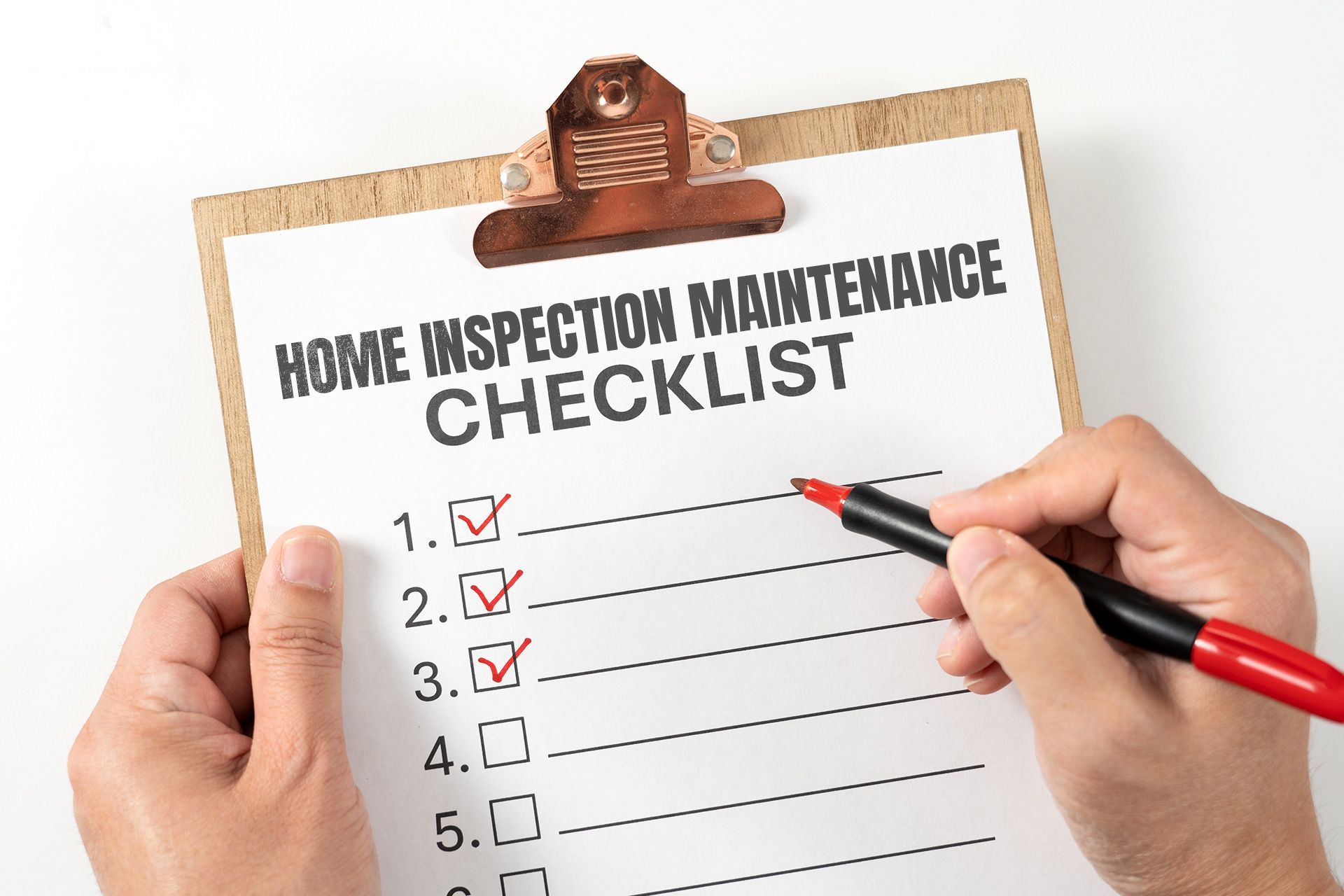 Homeowner checking a maintenance checklist.