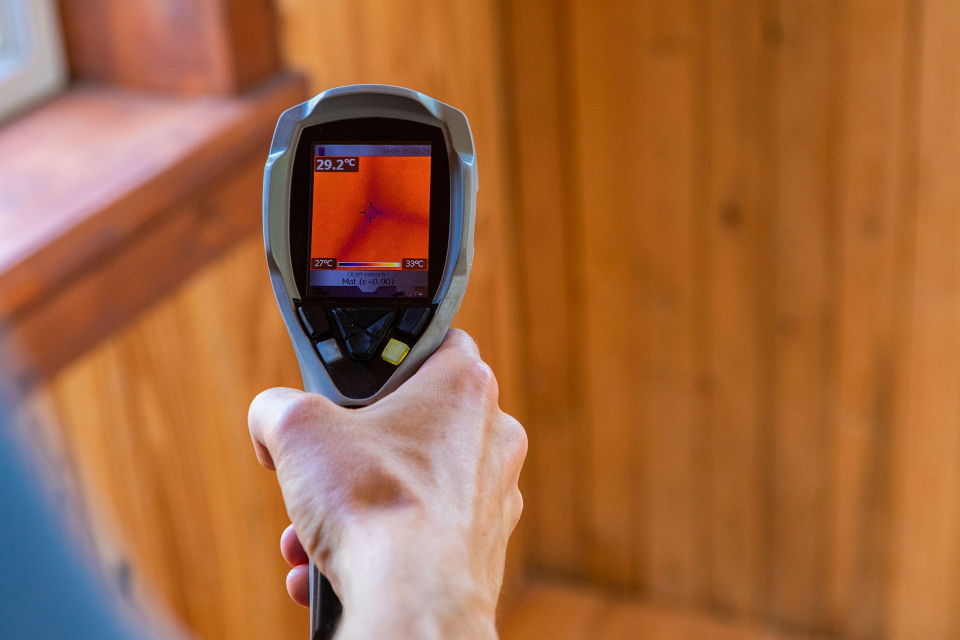 Home inspector using a thermal imaging camera during a Michigan home inspection