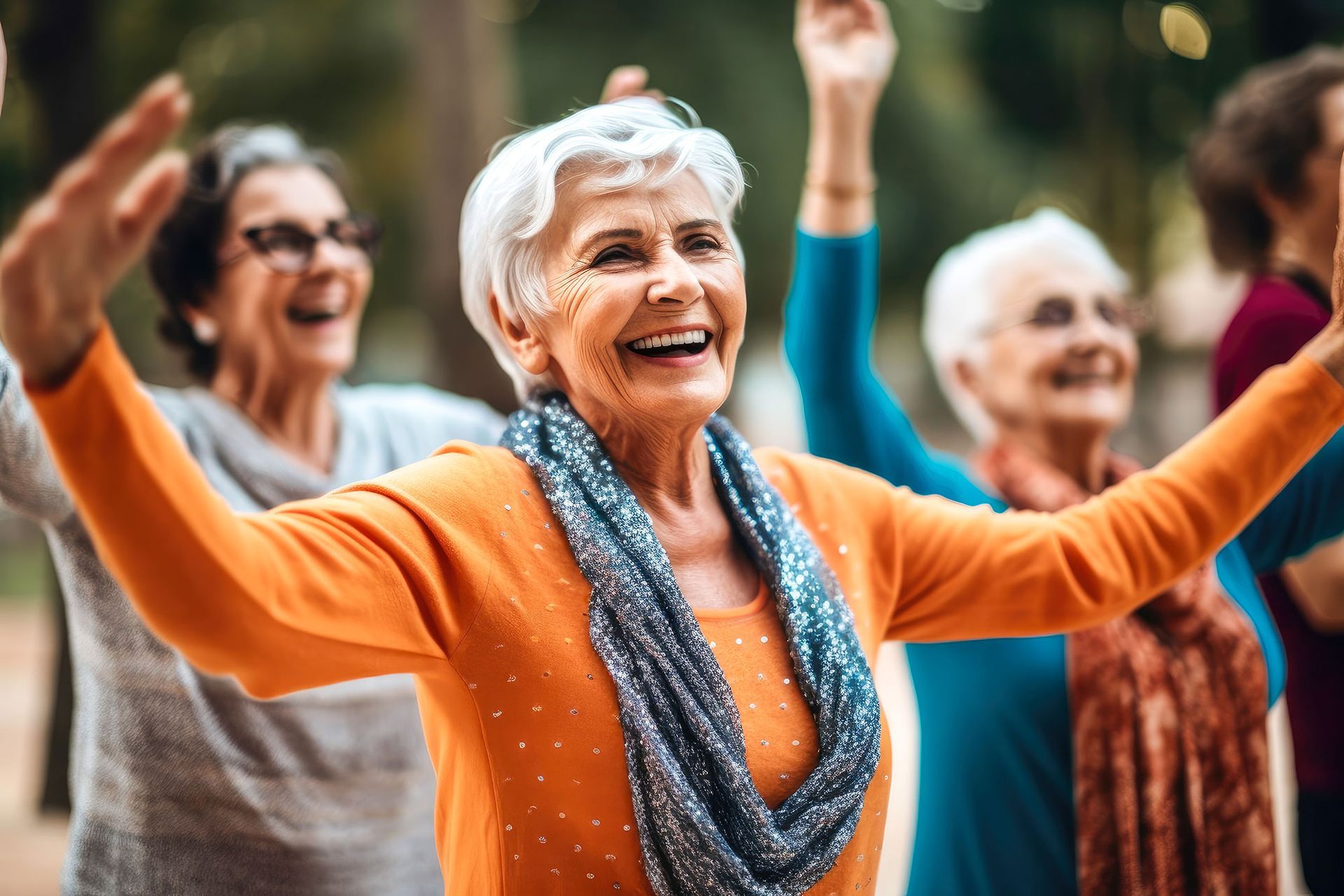 A group of senior women are dancing together in a park.