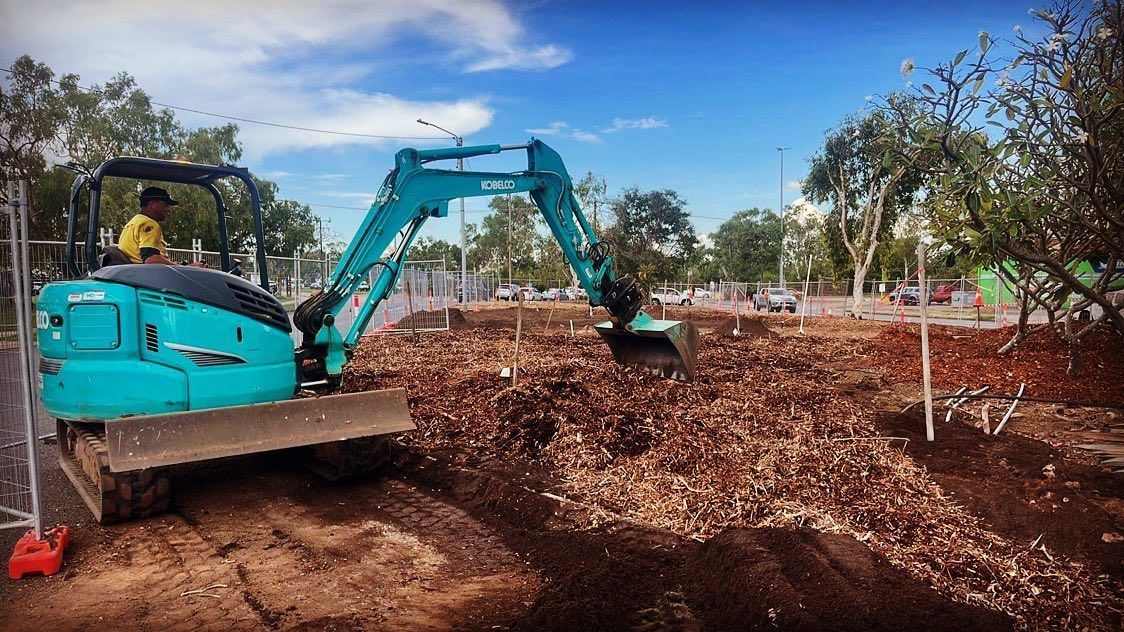Man On Excavator Preparing For Commercial Landscaping — Rural & Commercial Landscaper in Palmerston, NT