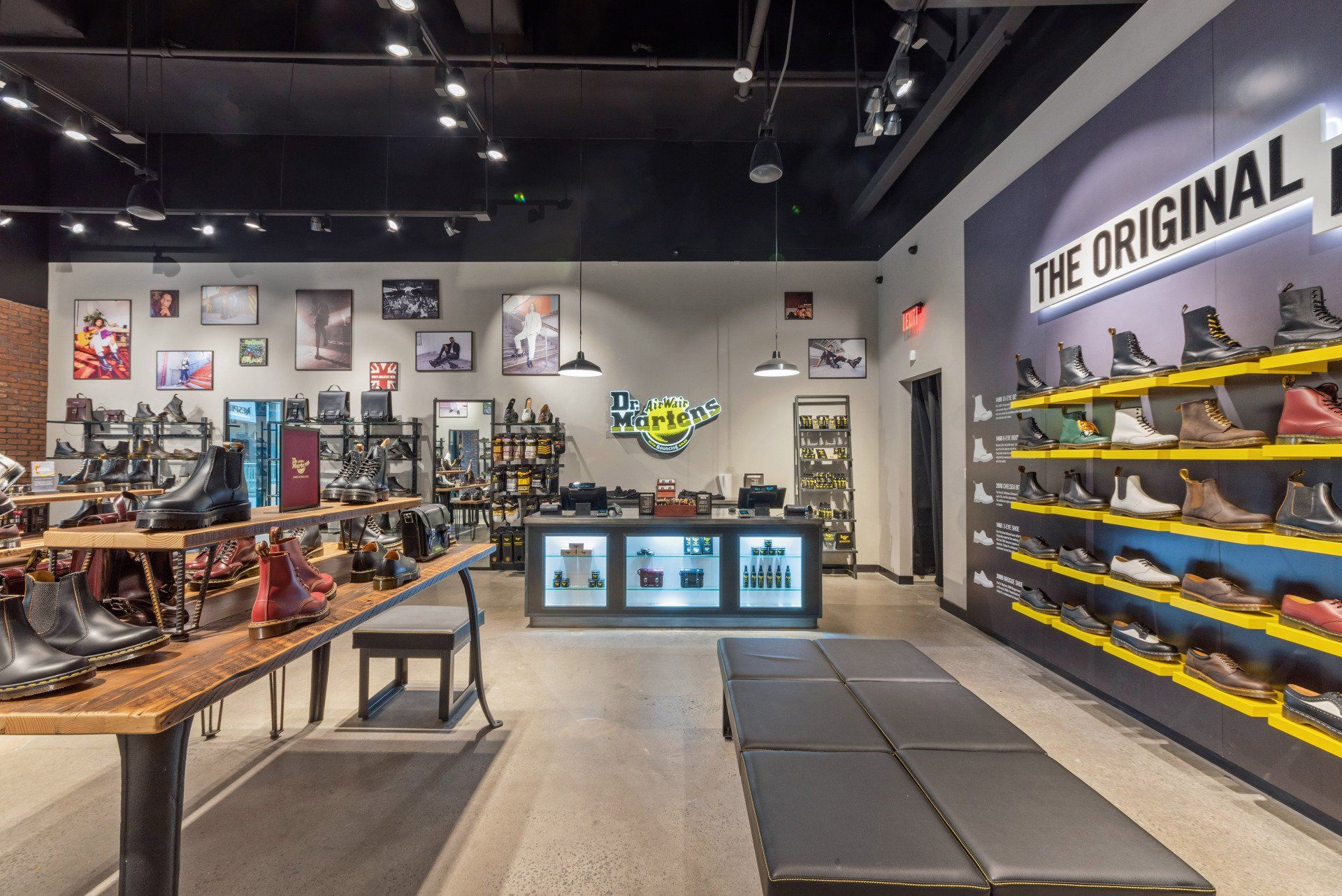 Dr. Martens shoe store interior, featuring boot displays, a checkout counter, and various branding elements.