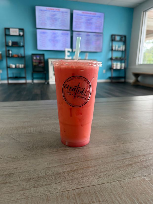 Meal replacement protein shakes with creamy textures and healthy toppings in a bright nutrition shop.