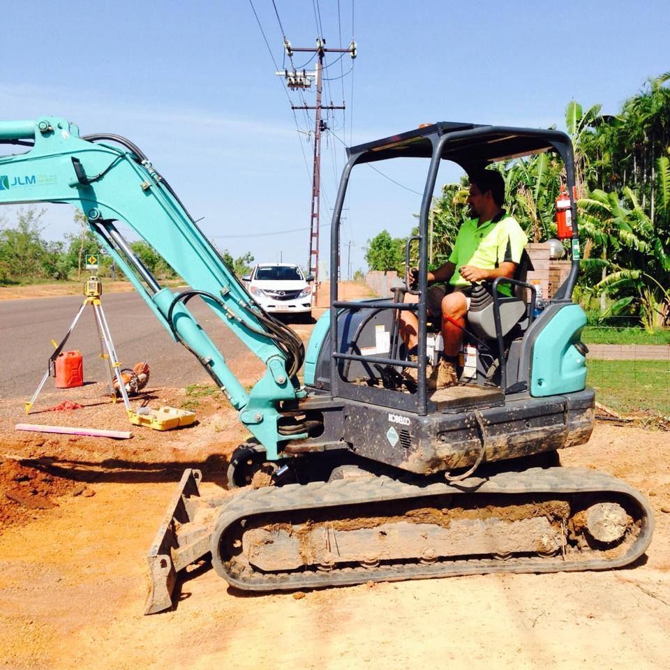 A Worker Using A Excavator — JLM Contracting Services Pty Ltd in Virginia, NT